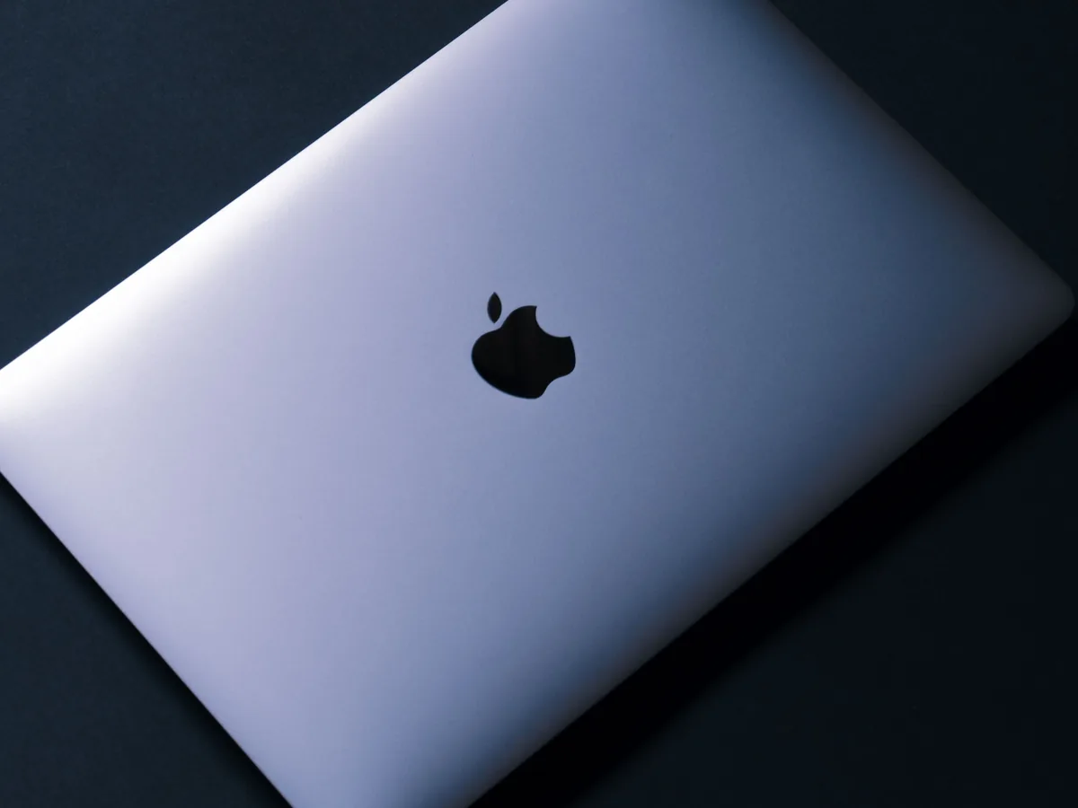 Real Apple MacBook photographed on a dark background